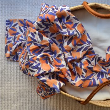 Muselina Naranjas en una cesta